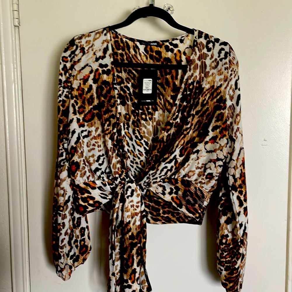 Fashion Nova wrap around animal print top.